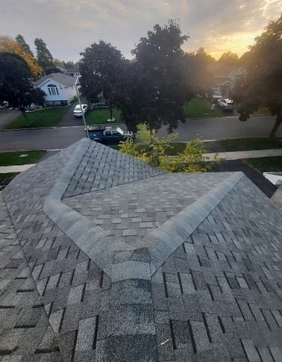 Before: Worn-out, damaged roof leaving the home unprotected. After: Durable, professional roofing installed by Garlow Roofing—built to last.